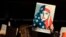 FILE - A protester holds a sign at San Francisco International Airport during a demonstration to denounce President Donald Trump's executive order that bars citizens of seven predominantly Muslim-majority countries from entering the U.S., Jan. 28, 2017.