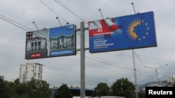 A view shows election billboards of the ruling Georgian Dream party, one of which depicts a devastated Ukrainian city contrasted against a peaceful Georgian one, in Tbilisi, Georgia September 27, 2024. 