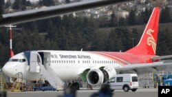 A brand-new Shenzhen Airlines Boeing 737 Max 8 airplane sits parked at Boeing Field, March 14, 2019, in Seattle. The fatal crash Sunday of a 737 Max 8 operated by Ethiopian Airlines was the second fatal flight for the model in less than six months.