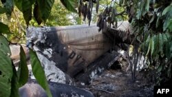 This handout picture released by Guatemala's Army press office shows rubble after a plane carrying drugs crashed in Santa Marta Salinas village, Chisec municipality, Guatemala, on Sept. 23, 2020. 