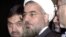 FILE - Hassan Rohani, center, during a meeting at the European Council building in Brussels, Nov. 17, 2003.