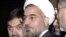 Hassan Rohani, center, during a meeting at the European Council, Brussels, Nov. 17, 2003 file photo.