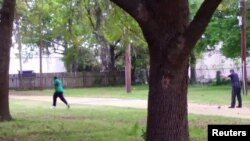 North Charleston police officer Michael Slager (R) is seen allegedly shooting 50-year-old Walter Scott in the back as he runs away, in this still image from video in North Charleston, South Carolina taken April 4, 2015. 