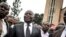 Vital Kamerhe, président de l'Union pour la Nation Congolaise (UNC), se tient devant la cathédrale après le service, le 12 janvier 2018. (AFP)