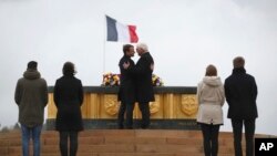 French President Emmanuel Macron, center left, and German President Frank-Walter Steinmeier attend the World War One commemoration ceremony in Hartmannswillerkopf, eastern France, Friday, Nov. 10, 2017. 