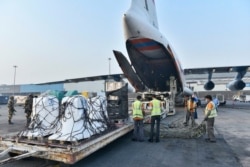 This photograph released by Indian External Affairs Ministry shows a shipment of oxygen concentrators, ventilators and other medical supplies arrived from Russia to India, April 29, 2021.