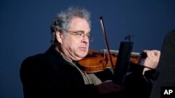 FILE - Itzhak Perlman plays the violin during the National Menorah lighting in celebration of Hanukkah near the White House in Washington, Dec. 10, 2010. The Israeli-American violinist has been awarded this year's "Jewish Nobel" on Monday, Dec. 14, 2015.