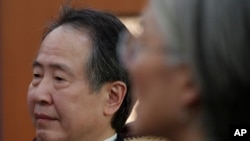 On March 6, 2020, Japanese Ambassador to South Korea Koji Tomita, left, listens to South Korean Foreign Minister Kang Kyung-wha during a meeting at the Foreign Ministry in Seoul, South Korea.