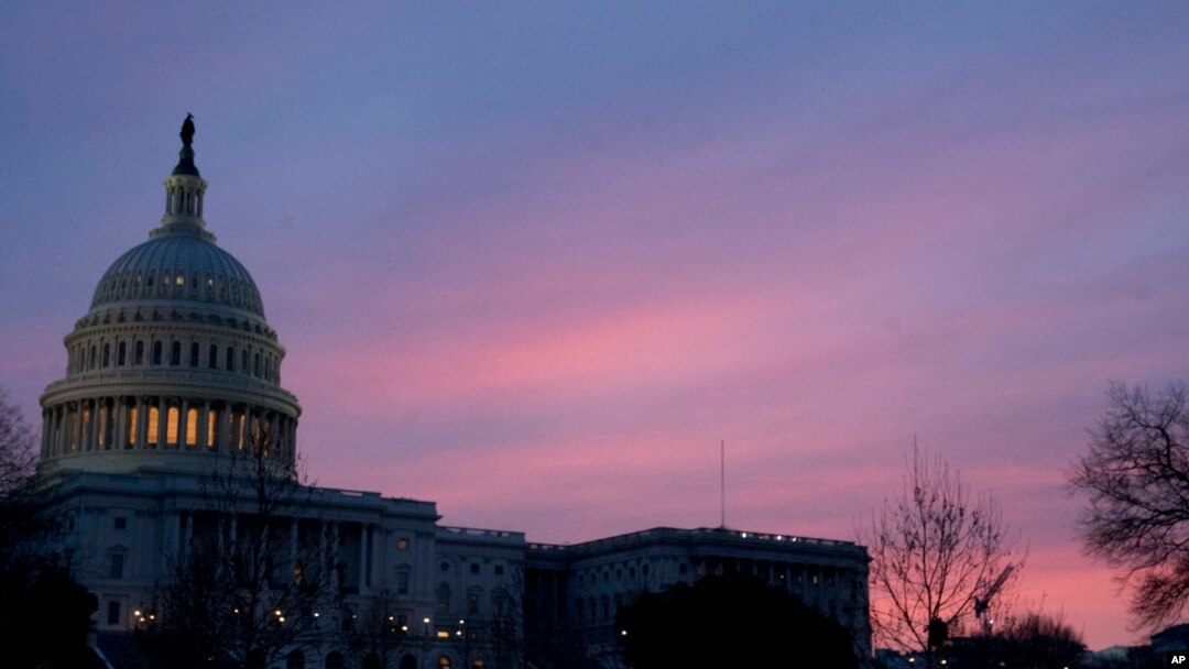 The Capitol Dome of the Capitol Building at sunrise, Feb. 9, 2018, in Washington. Congressional negotiators have reached the critical stage in talks to shape a $1.3 trillion spending bill.
