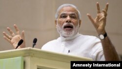 FILE - India’s Prime Minister Narendra Modi, shown delivering a speech in New Delhi in April, will visit Bangladesh June 6-7.