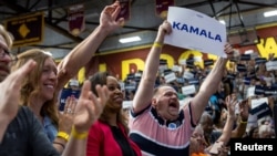 Supporters of U.S. Vice President Kamala Harris cheer at a campaign event at West Allis High School in West Allis, Wisconsin, July 23, 2024.
