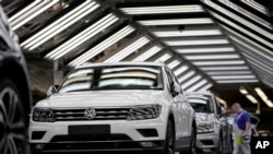 FILE - In this March 8, 2018 photo Volkswagen cars are pictured during a final quality control at the Volkswagen plant in Wolfsburg, Germany.