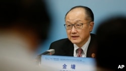 FILE - World Bank President Jim Yong Kim attends a news briefing after the Third Round Table Dialogue in Beijing, China, Nov. 6, 2018.