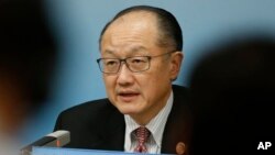 FILE - World Bank President Jim Yong Kim attends a news briefing after the Third Round Table Dialogue in Beijing, China, Nov. 6, 2018.