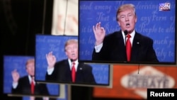 Republican U.S. presidential nominee Donald Trump is shown on TV monitors in the media filing room on the campus of University of Nevada, Las Vegas, during the last 2016 U.S. presidential debate in Las Vegas, U.S., Oct. 19, 2016.