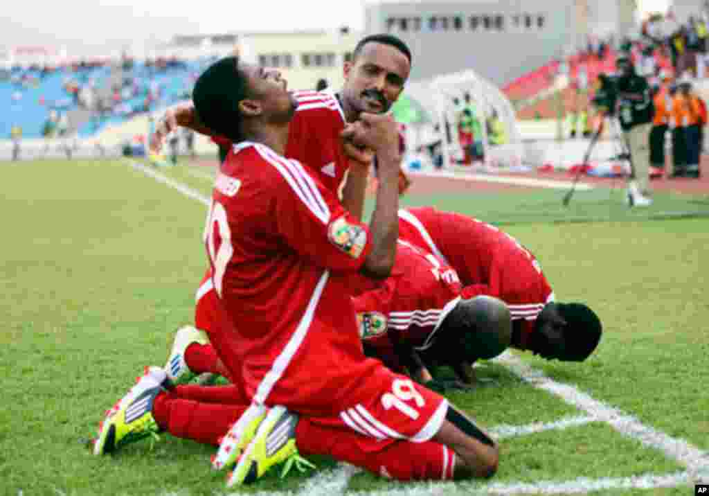 Sudan's Bashir celebrates with teammates after scoring against Angola during their African Nations Cup soccer match in Malabo