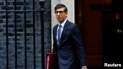 British Prime Minister Rishi Sunak walks on Downing Street, in London