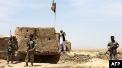 Afghan Border Police personnel keep watch during an ongoing battle between Pakistani and Afghan Border forces near the Durand line at Spin Boldak, in southern Kandahar province, May 5, 2017.