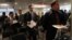 Veterans wait to speak to a representative from Securitas during a job fair at Yankee Stadium in the Bronx borough of New York, September 28, 2012.