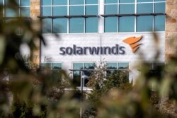 FILE - The SolarWinds logo is seen outside its headquarters in Austin, Texas, Dec. 18, 2020.