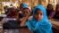 FILE - Young girls attend a math class in January 2014 at a school in Niger's Diffa region, where more than half of the students are Nigerians who have been displaced by fighting.