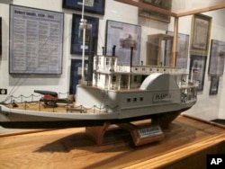 FILE - A model of the CSS Planter — the slaveholder's ship stolen by Robert Smalls — is displayed at the Charleston Museum, part of a traveling exhibit entitled "The Life and Times of Congressman Robert Smalls," on May 2, 2012, in Charleston, South Carolina.