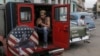 A person uses a cellphone inside a private cab in Havana, Cuba, Jan. 15, 2025. 