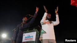 FILE — Senegalese opposition leader Ousmane Sonko and Bassirou Diomaye Faye, the presidential candidate he is backing in the March 24 election, attend the final campaign rally in Mbour, Senegal, on March 22, 2024.