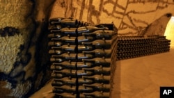 Champagne bottles piled in the cave of the Vranken-Pommery Monopole in Reims, east of Paris, July 28, 2020. Producers in France say they’ve lost about 1.7 billion euros ($2 billion) in sales this year.