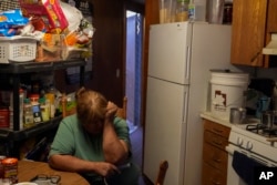 Lorraine Black sits inside her kitchen, Oct. 9, 2024, on the Navajo Nation in Halchita, Utah.