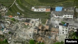 An aerial view shows houses damaged after a strong earthquake in Lushan county, Ya'an, Sichuan province, Apr. 20, 2013. 