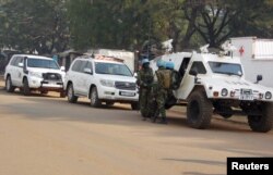 FILE - U.N. peacekeepers take a break as they patrol along a street during the presidential election in Bangui, the capital of Central African Republic, Dec. 30, 2015.