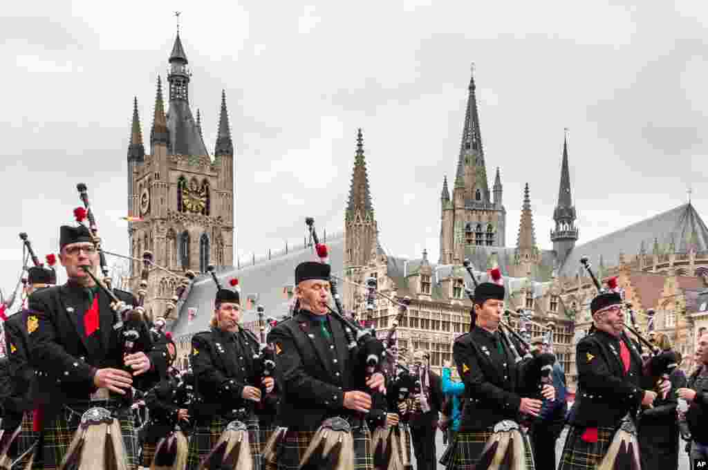 Bagpipers with the Scots regiment perform as they march from the Belfort towards the Menin Gate during an Armistice Day ceremony in Ypres, Belgium. The Menin Gate Memorial bears the names of more than 54,000 British and Commonwealth soldiers who were killed in the Ypres Salient of World War I and whose graves are not known.