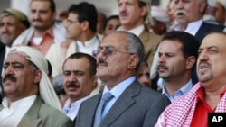 Yemen's President Ali Abdullah Saleh (C) attends a rally held by pro-government supporters in Sanaa, May 13, 2011