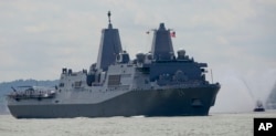 FILE - FILE - The USS Arlington arrives on the Hudson River in New York, May 23, 2018.