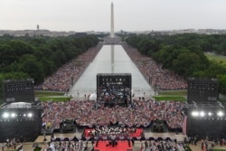 President Donald Trump speaks during an Independence Day celebration in front of the Lincoln Memorial in Washington, July 4, 2019. The Washington Monument and the reflecting pool are in the background.