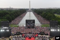 President Donald Trump speaks during an Independence Day celebration in front of the Lincoln Memorial in Washington, July 4, 2019. The Washington Monument and the reflecting pool are in the background.