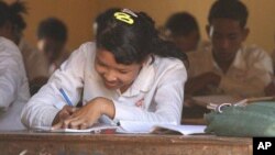 A girl sits in a history class at the local high school in, Cambodia.