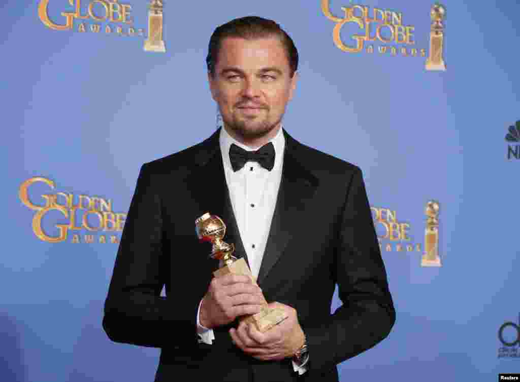 Leonardo DiCaprio poses with the award for Best Actor in a Motion Picture, Musical or Comedy for his role in &quot;The Wolf of Wall Street&quot; at the Golden Globe Awards in Beverly Hills, California, Jan. 12, 2014. 