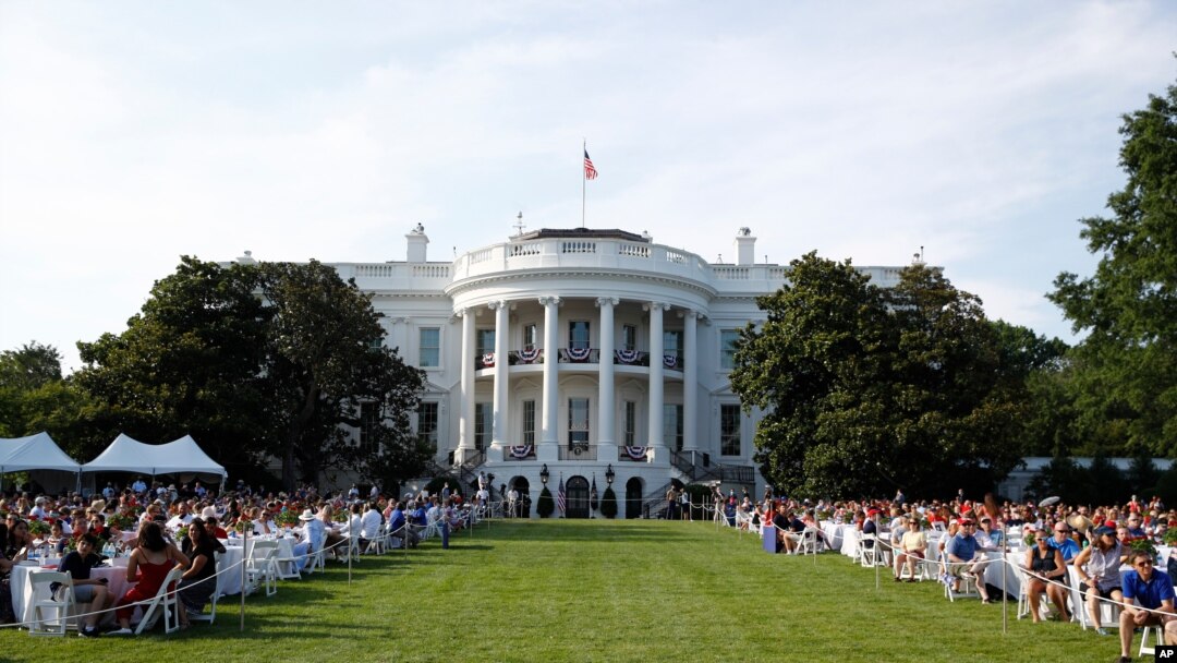 Guests wait for President Donald Trump and first lady Melania Trump during a "Salute to America" event on the South Lawn of the White House, July 4, 2020, in Washington. 