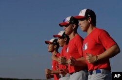 In this June 23, 2017 photo, major-league prospect Eric Pardinho, right, jogs with teammates in Ibiuna, Brazil.