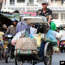 Im Sambath is the head of the cyclo association. He says tourism is the way forward for the city's embattled cyclo drivers.