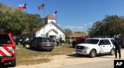 Emergency personnel respond to a fatal shooting at a Baptist church in Sutherland Springs, Texas, Nov. 5, 2017.