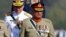 Pakistan Defense Minister Khurram Dastgir, left, with Army Chief Qamar Javed Bajwa, right, and other officers arrive for a military parade in Islamabad, Pakistan, Friday, March 23, 2018. (AP Photo/Anjum Naveed)