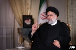 FILE - A handout picture provided by Iran's Presidency on October 28, 2023, shows Iranian President Ebrahim Raisi during an interview with the Qatari state-owned news television network Al-Jazeera in Tehran