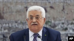 Palestinian President Mahmoud Abbas talks during a leadership meeting in Ramallah, Tuesday, April 1, 2014