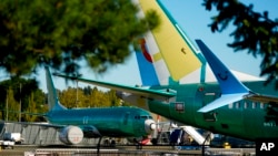 FILE - Unpainted Boeing 737 Max aircraft are seen at the company's facilities in Renton, Washington, Sept. 24, 2024. Boeing plans to lay off about 10% of its workers in coming months.