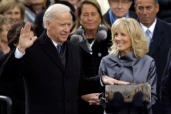 Jill Biden looks at her husband Vice President Joe Biden as he sworn-in at the ceremonial swearing-in at the U.S. Capitol during the 57th Presidential Inauguration in Washington, Monday, Jan. 21, 2013. (AP Photo/Carolyn Kaster)