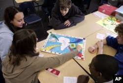 FILE — Eighth-grade social studies students at Mount Hebron School in Montclair, New Jersey, play a game they devised based on the story of the revolt on the slave ship Amistad.