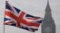FILE - A Union flag flies in front of the Big Ben clock tower in London, Britain, Jan. 23, 2017. 
